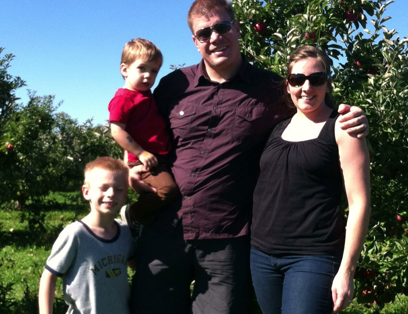 Amber Kroeker (right) with her husband and two of her three kids. 