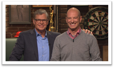 Local dad Dustin Kuras (right), on the Sports Jeopardy Show with host Dan Patrick (left).