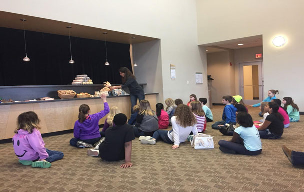 Farmer Noelle from Noka Farm discussing local farm foods with elementary school children. Photo credit: Dawn Nelson