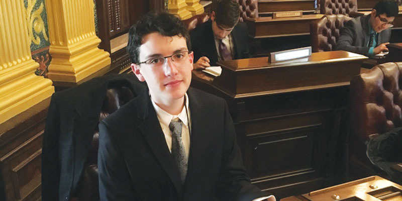 Charlie-Hickman-sitting-in-the-House-Chairs