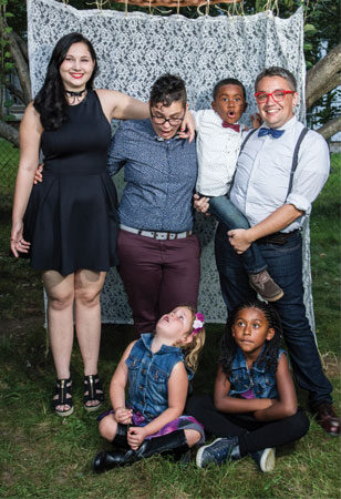 Luca, in blue, celebrating on her wedding day with partner Matthias, her sister Alisha, and their children Zeki, 7, Abijah, 10, and Gianna, 8. Photo Credit: Ian Tadashi Moore.