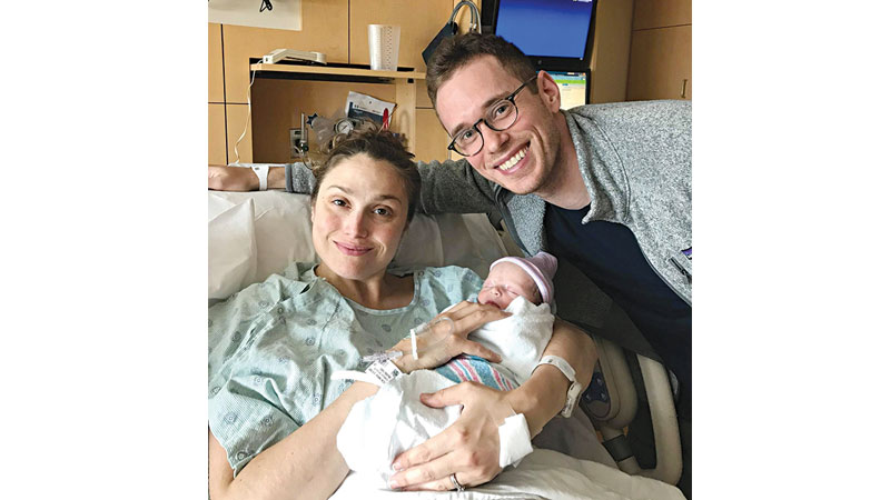 Mike and Hilary Gustafson with their newborn baby, Greta Lane.