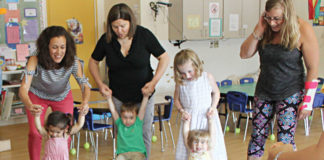 At left, First Steps teacher Susanna Brown leads the Exploration Zone class at the Ann Arbor Family and Preschool Center, 2775 Boardwalk Drive.