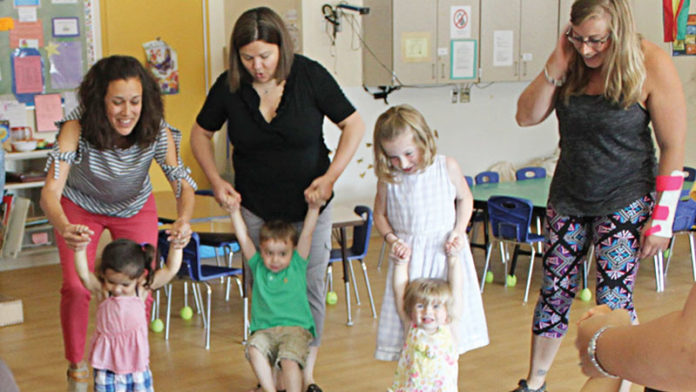 At left, First Steps teacher Susanna Brown leads the Exploration Zone class at the Ann Arbor Family and Preschool Center, 2775 Boardwalk Drive.