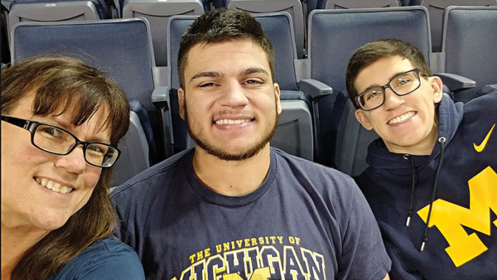 Sandy Goetz and her teen sons, Parker (L) and Jarad (R).