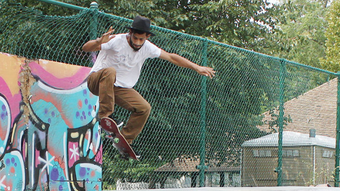 Ypsilanti skater enthusiast Cory Spivey goes airborne while trying out some new moves at Prospect Park in Ypsilanti.