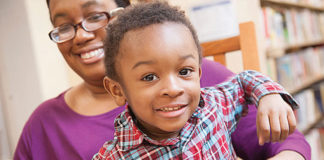 Mother Dara McCloud and her son Kaari participating in a Michigan Alliance for Families informational session. Photo courtesy of gud marketing