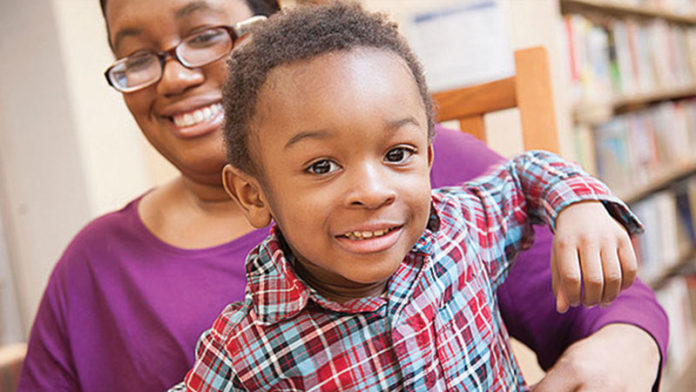 Mother Dara McCloud and her son Kaari participating in a Michigan Alliance for Families informational session. Photo courtesy of gud marketing