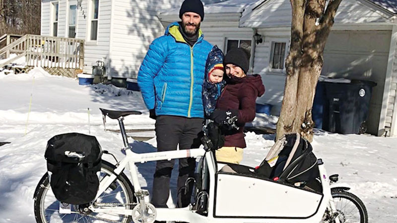 Nate Phipps and Michelle Bellino with son, Reed on a winter day.