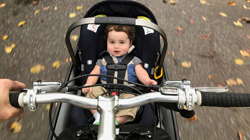Reed, 14 months, goes for a ride on his dad’s (Nate Phipps) Bullitt cargo bike.