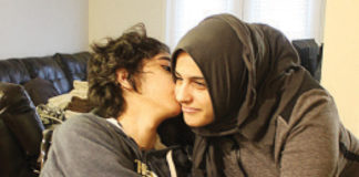 Hiatham Breadiy gives his mother, Azeza Kasham, a kiss. He has a rare form of epilepsy called Lafora. The disease typically strikes seemingly healthy children in their teens and progressively gets worse over time.