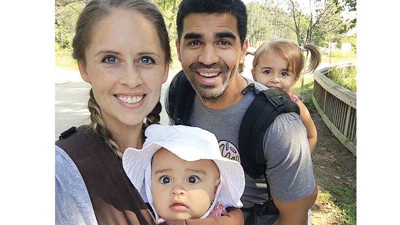 Scarlett Middle School band teacher Caroline Fitzgerald poses with her husband Sean and daughters Alaina, 2, and Gabrielle, 6 months, while hiking in Hocking Hills, Ohio last summer.