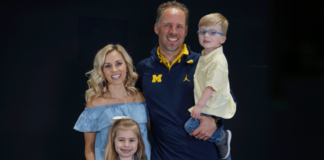 UM quarterbacks coach Ben McDaniels with his family: wife, Kyle; and children, Kinley Grace, 6; and Brooks Thomas, 3. While football looms large in the McDaniels household, the kids are busy just being kids. McDaniels said Kinley loves cheer, dance and gymnastics, while Brooks is into trucks, wrestling and pretending he has superpowers. Photo by Aaron Bills/Michigan Football.