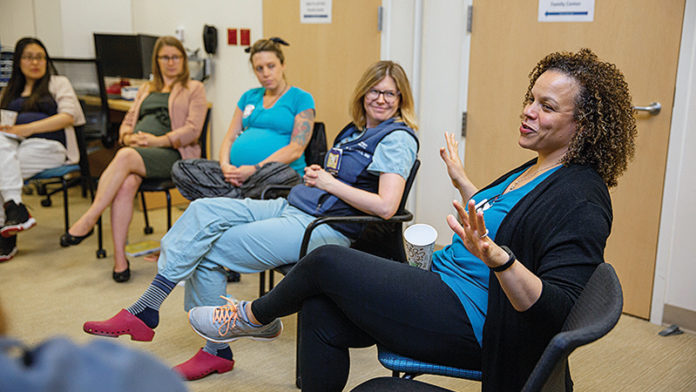 Expectant parents engaging during a CenteringPregnancy® meeting. Photo credit: Brian McCullough