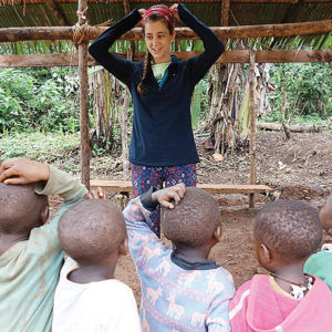 Sarah Strader, Ann Arbor native and founder of Two Rabbits, facilitates a lesson for Baka children in Cameroon. Photo contributed by Sarah Strader