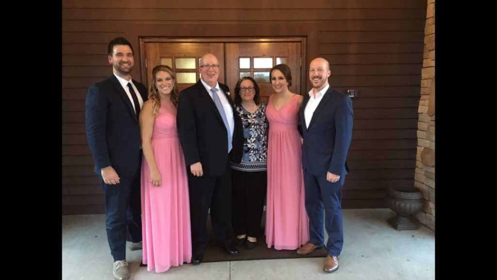 Colleen Bean is a mentor to young moms. She is pictured here with her family. From left are her son-in-law Nick and daughter Meg; her husband, Mike; Colleen Bean, and her children Danielle and Andy.