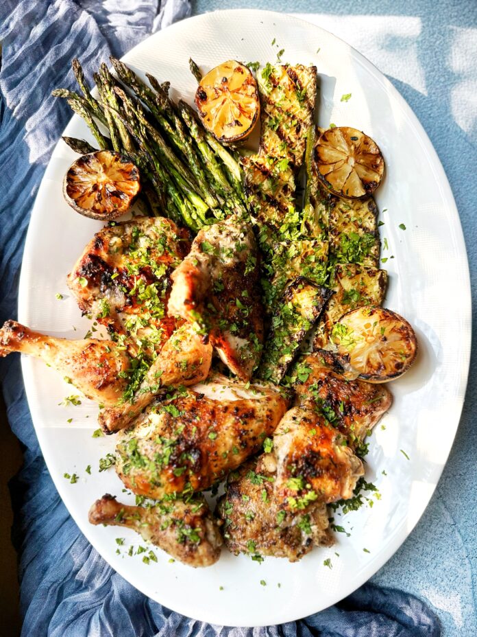 platter of grilled chicken asparagus and zucchini
