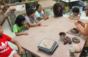 Kids sitting at a table together.