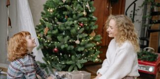 A picture of a family opening gifts.