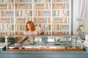 A store owner behind the counter.