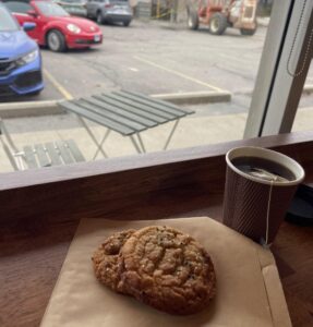 A cup of tea and a baked good from the Q Bakery.