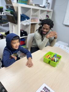 Two people sitting at a table.