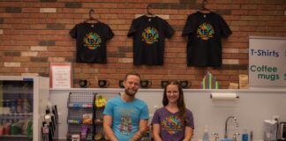 Two employees behind the counter at Play Station.