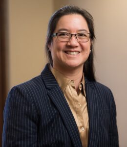 A photo of a person smiling.