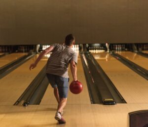 Person throwing a bowling ball
