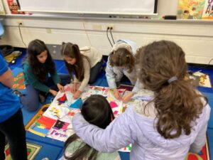Group of kids learning with their hands