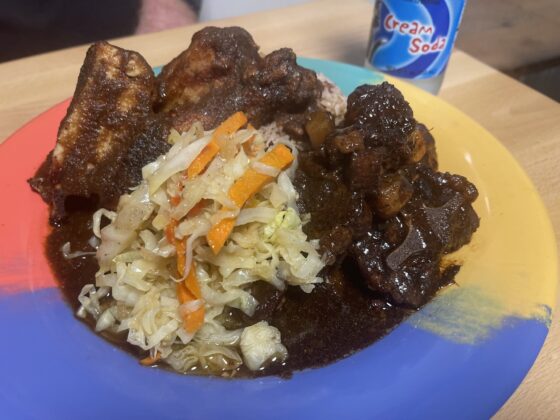 A plate of jamaican food.