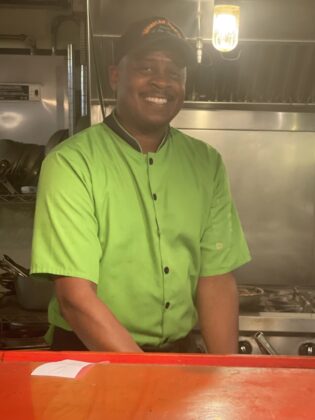 A person smiling for a picture.