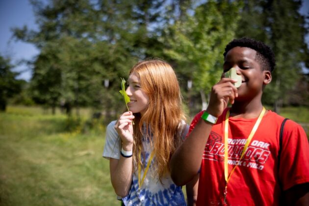 Teens smelling the flowers