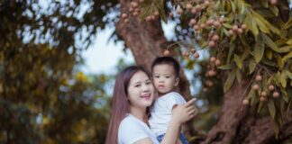 A parent holding their child.