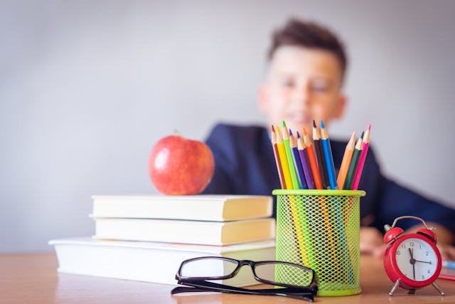 A child at a school desk.