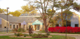 High school building in evening sun with vibrant fall colors
