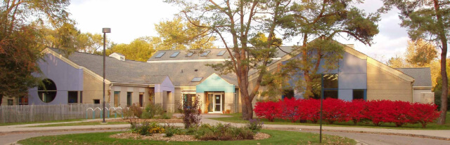 High school building in evening sun with vibrant fall colors