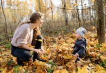Woman and child in yellow leaves