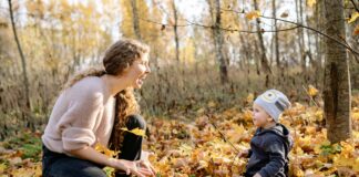 Woman and child in yellow leaves