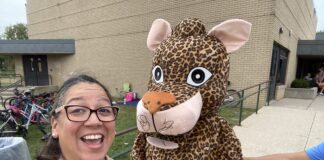 Woman taking selfie with mascot
