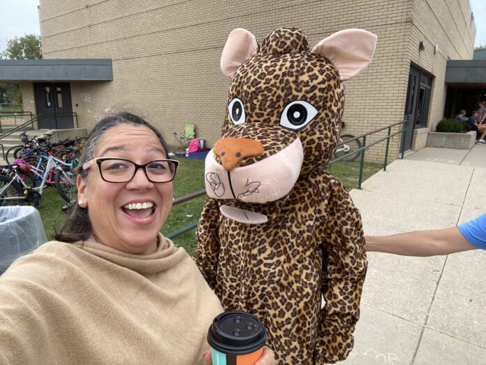 Woman taking selfie with mascot