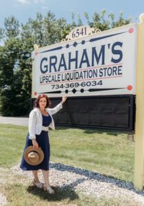 Photo of woman by sign 