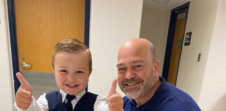 Man next to young child.