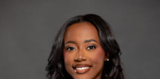 Woman in black shirt against gray background