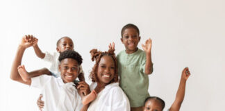 Family of five against white background