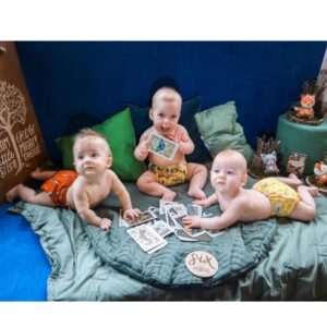 Three babies playing