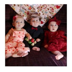 Three babies dressed up