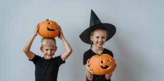 2 kids with pumpkins