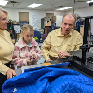 Two adults and young girl