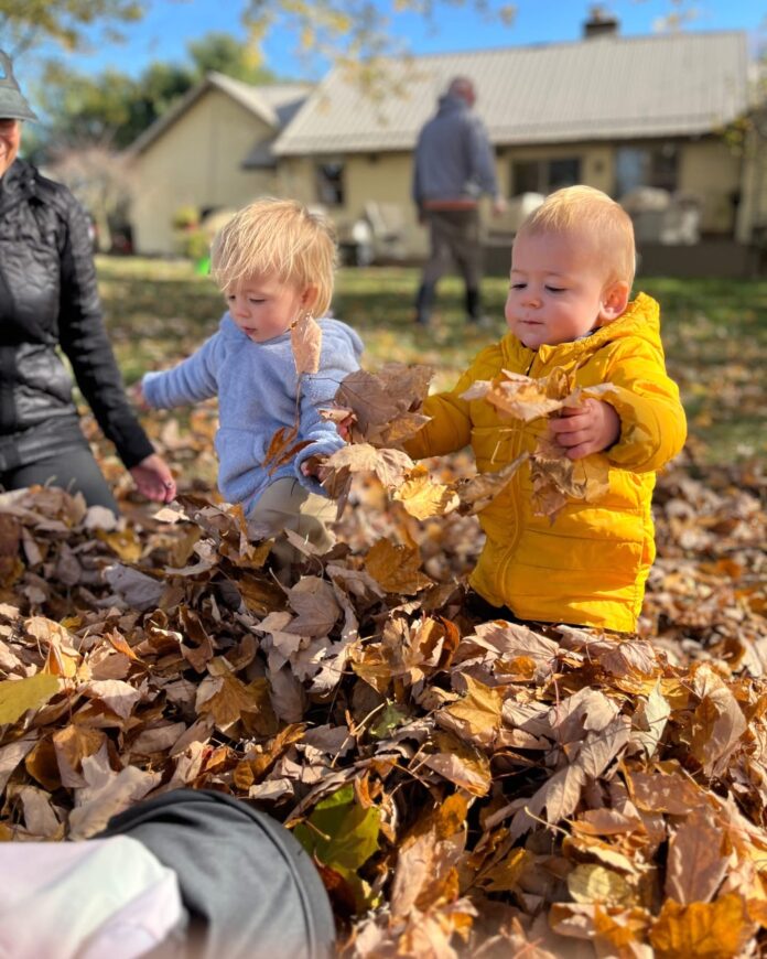 Kids playing in leaves
